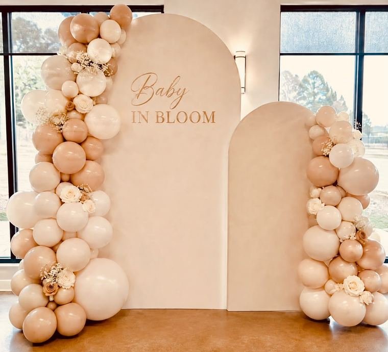 Baby in Bloom double arch with blush and cream balloon garlands